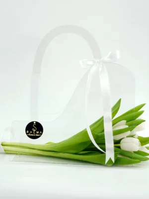 White Tulip Bag arrangement in a transparent acrylic handbag with white satin ribbons