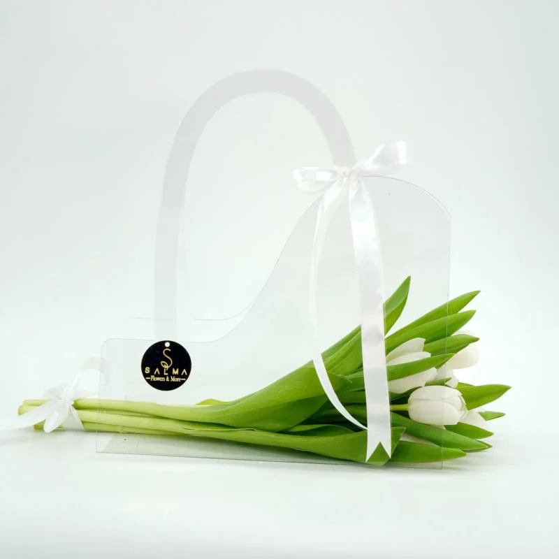White Tulip Bag arrangement in a transparent acrylic handbag with white satin ribbons