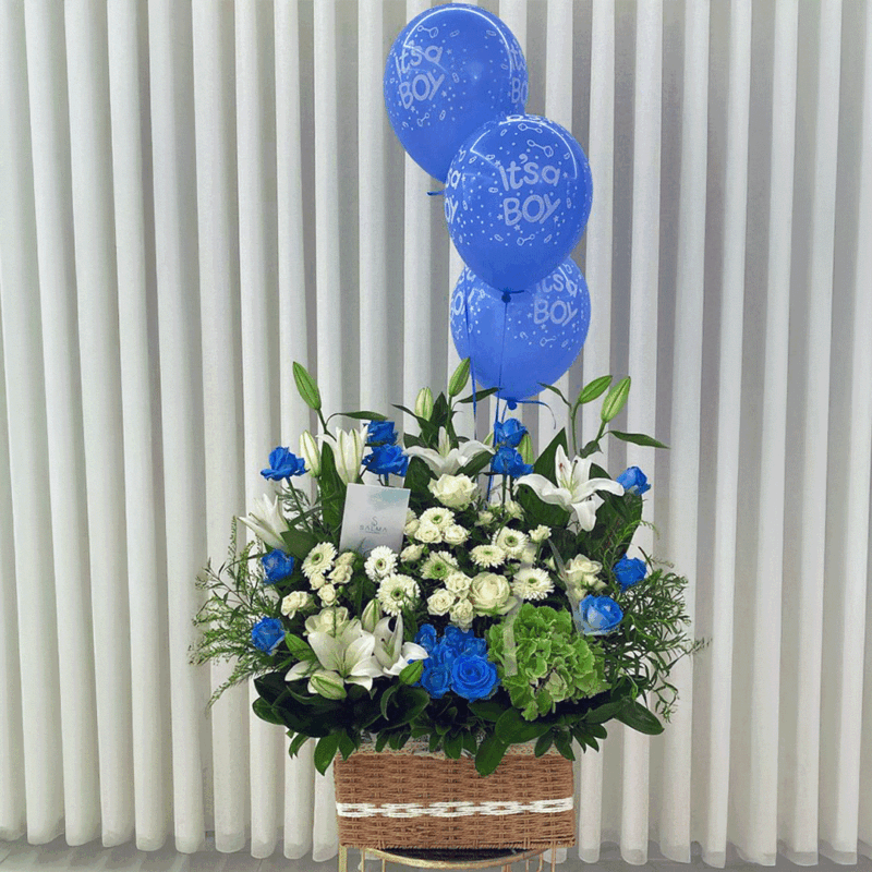 Baby boy flower basket with white lilies, blue roses, chrysanthemums, and green hydrangea