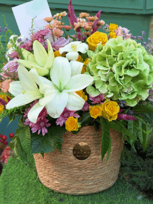 Elegant flower basket with hydrangea, roses, and mixed blooms
