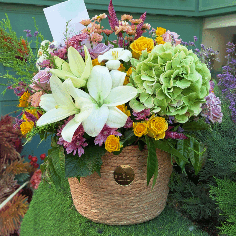 Elegant flower basket with hydrangea, roses, and mixed blooms
