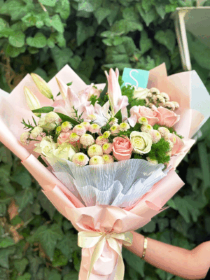 Pastel bouquet with casablanca lilies, pink roses, white roses, and pink chrysanthemums