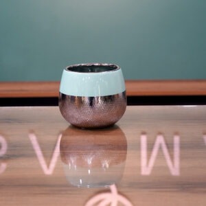 Two-Tone Mint Green and Metallic Copper Vase on a Reflective Surface